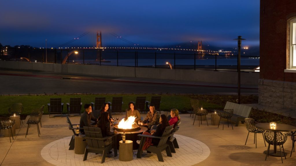 Evening around the firepit at the Lodge at Presidio with San Francisco's Golden Gate Bridge in background