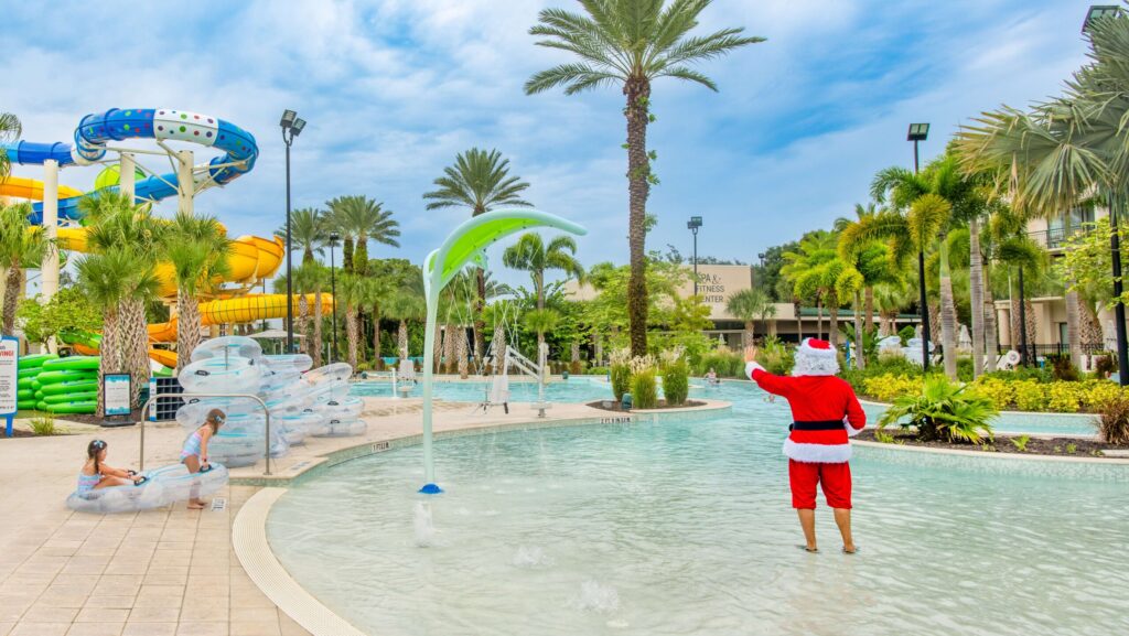 Santa waving to kids at the water park at the Orlando World Center Marriott