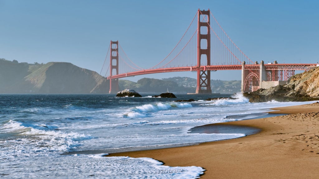 The Golden Gate Bridge with Baker Beach in foreground
