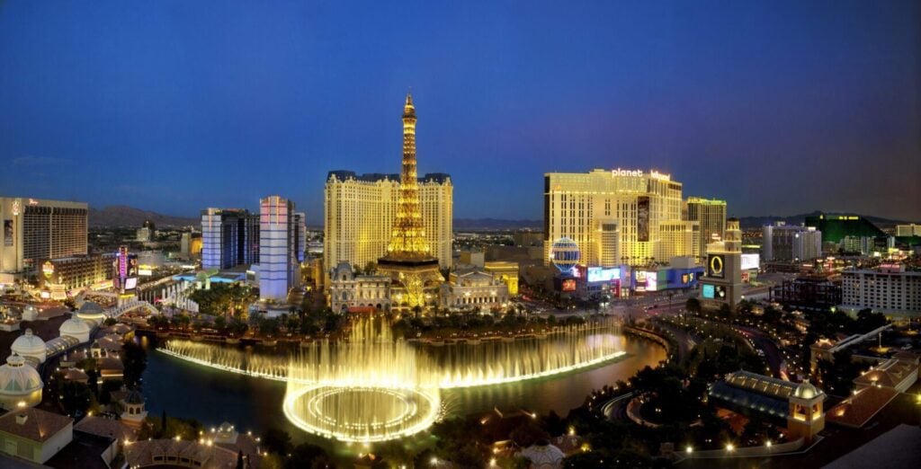 aerial night view of the Bellagio, fountains, and Paris Las Vegas Eiffel Tower