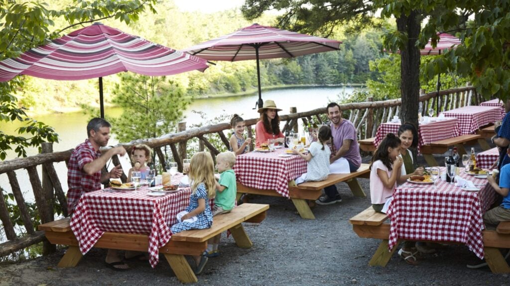 Outdoor dining area at Mohonk Mountain House with Lake Mohonk in background