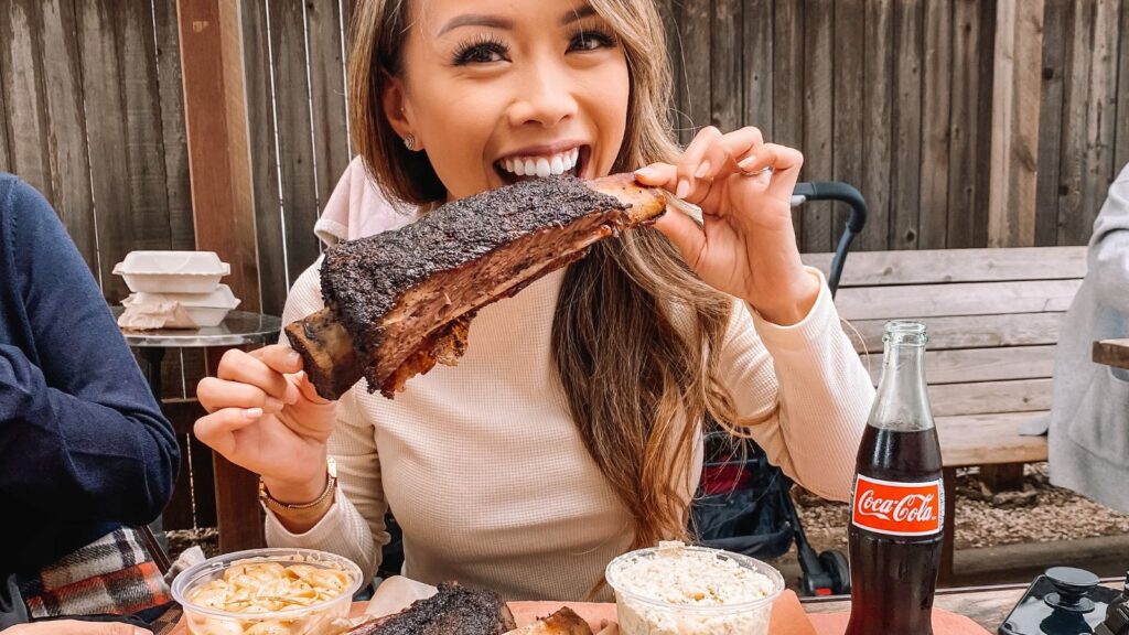 Woman eating BBQ in Austin, Texas (Photo: Vy Nguyen)