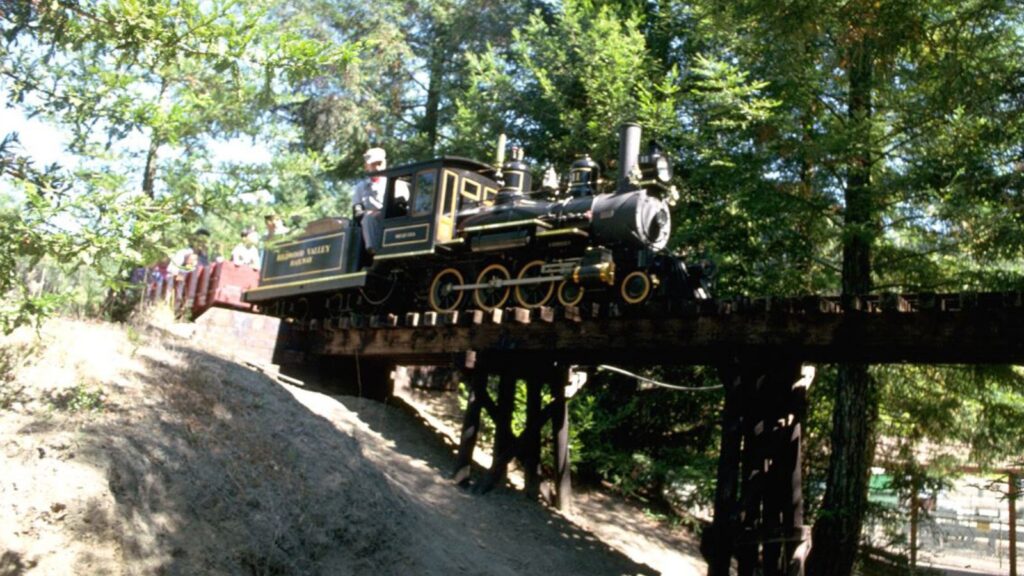 steam train coming through the trees and over a bridge in Tilden Park, Berkeley