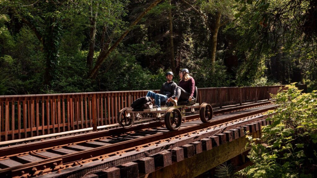 Two people on a Skunk Train Railbike in Mendocino