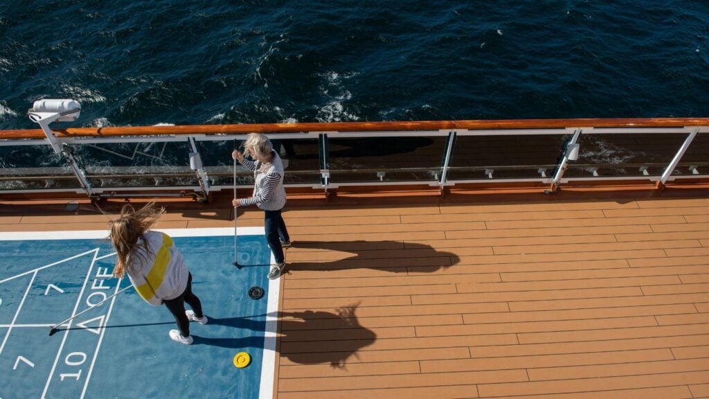 Multiple generations can connect over shuffleboard on a Holland America heritage cruise (Photo: HAL)