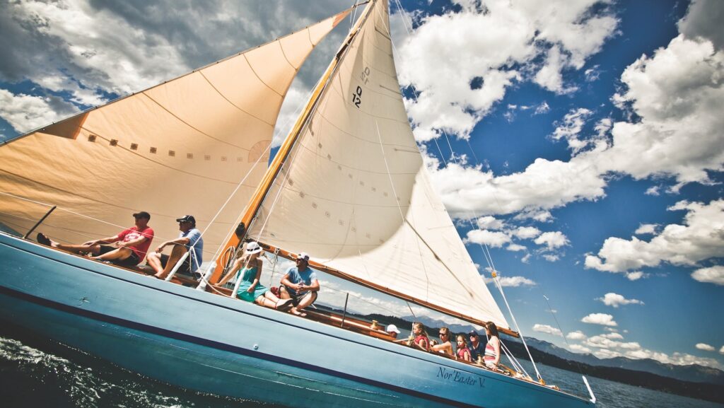 A multigenerational family on a sailboat on Flathead Lake