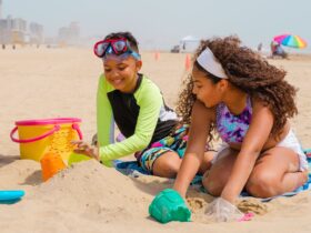 kids digging in the sand at the beach on South Padre Island in Texas