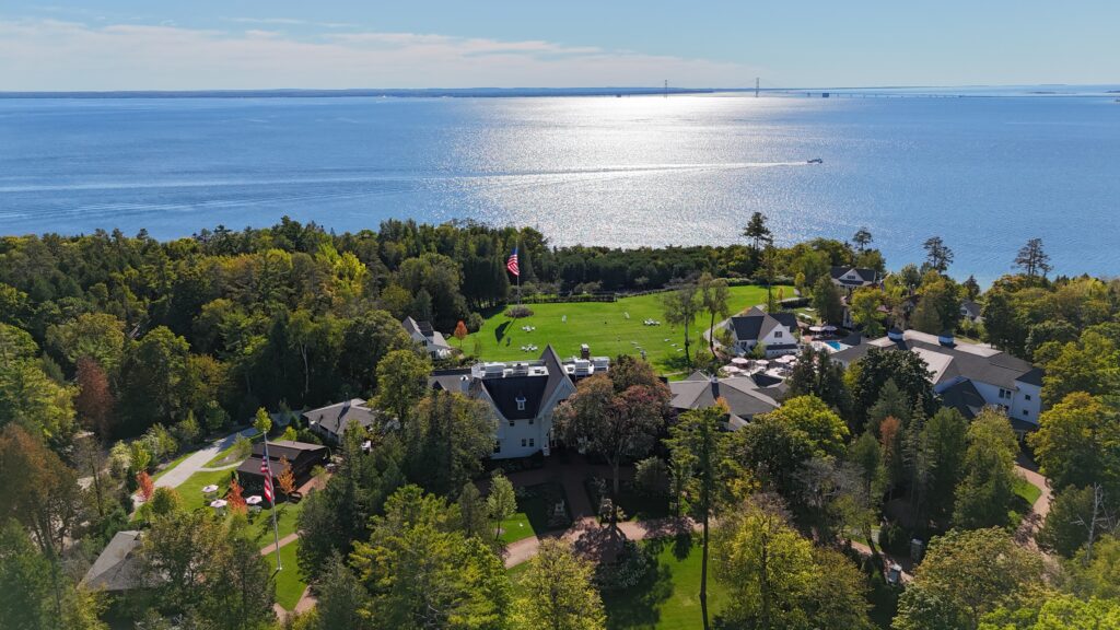 An aerial view of The Inn at Stonecliffe and its lawn area leading down toward Lake Huron