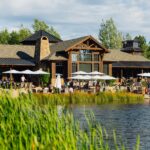 People of all ages enjoying the Lakehouse at Sunriver Resort on a sunny day