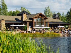 People of all ages enjoying the Lakehouse at Sunriver Resort on a sunny day