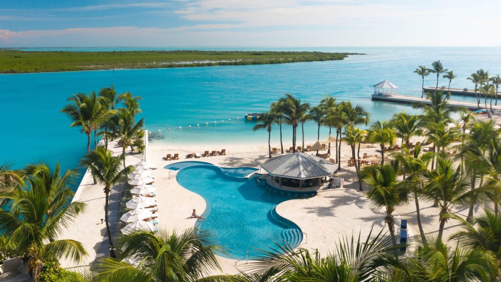 Aerial view of the pool and beach at Blue Haven Resort