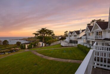 sunset view of Little River Inn in Mendocino and Pacific Ocean in the background
