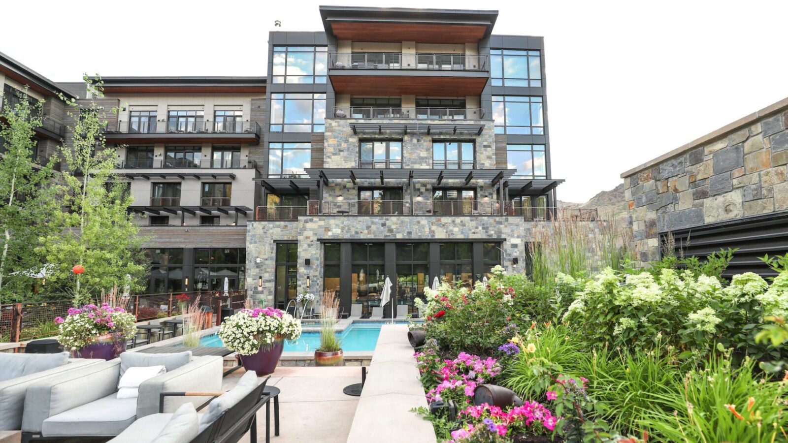 patio, building, and pool at the Limelight Ketchum Hotel
