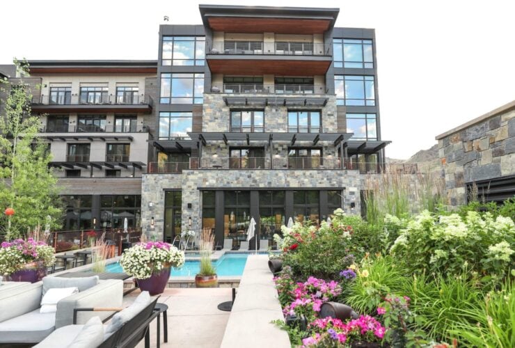 patio, building, and pool at the Limelight Ketchum Hotel