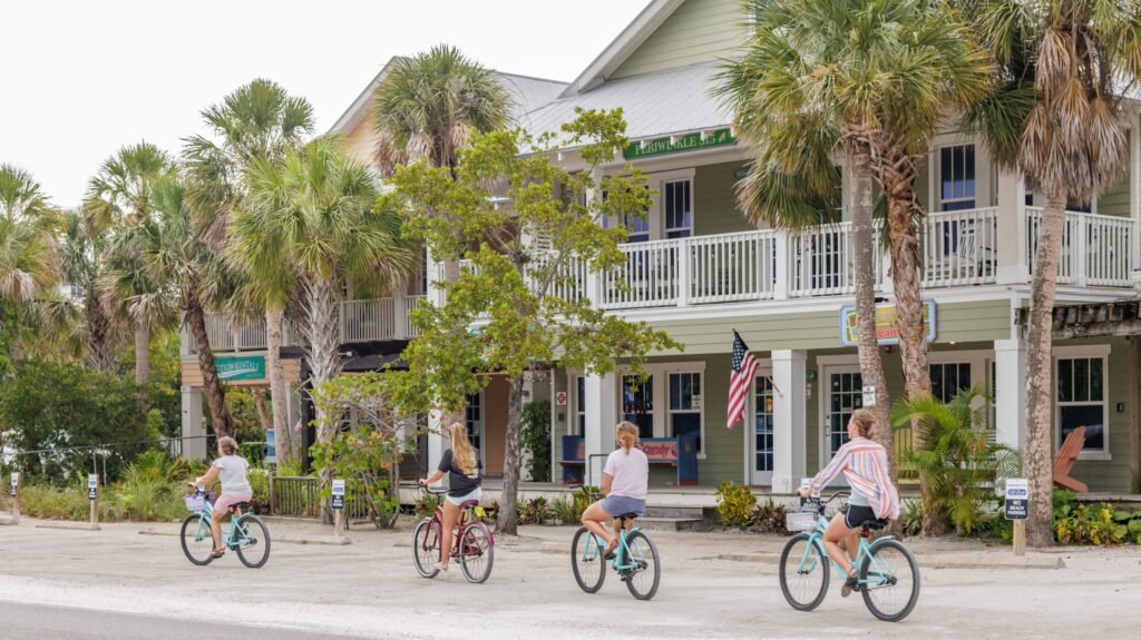Four people riding bikes on Pine Avenue in Anna Maria, Florida
