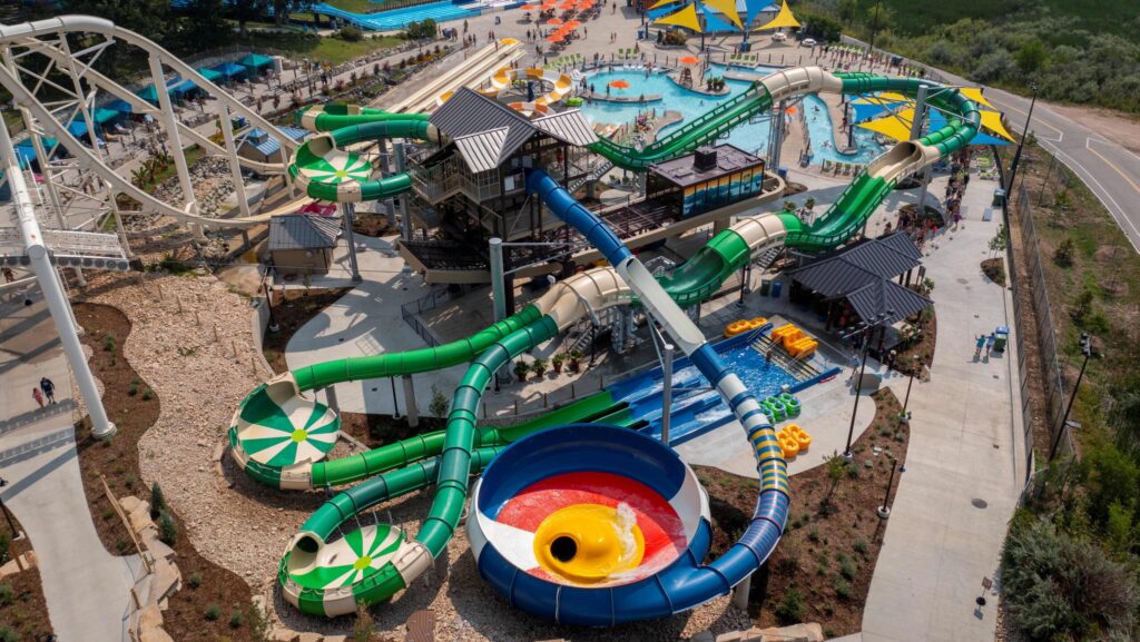 An aerial view of several colorful waterslides at Water World in Colorado