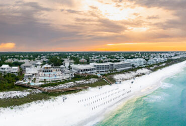An aerial view of WaterColor Inn and the beach at sunset