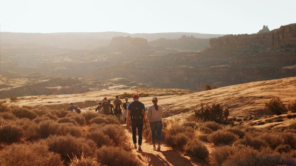 Family group walking on trails in Moab, Utah