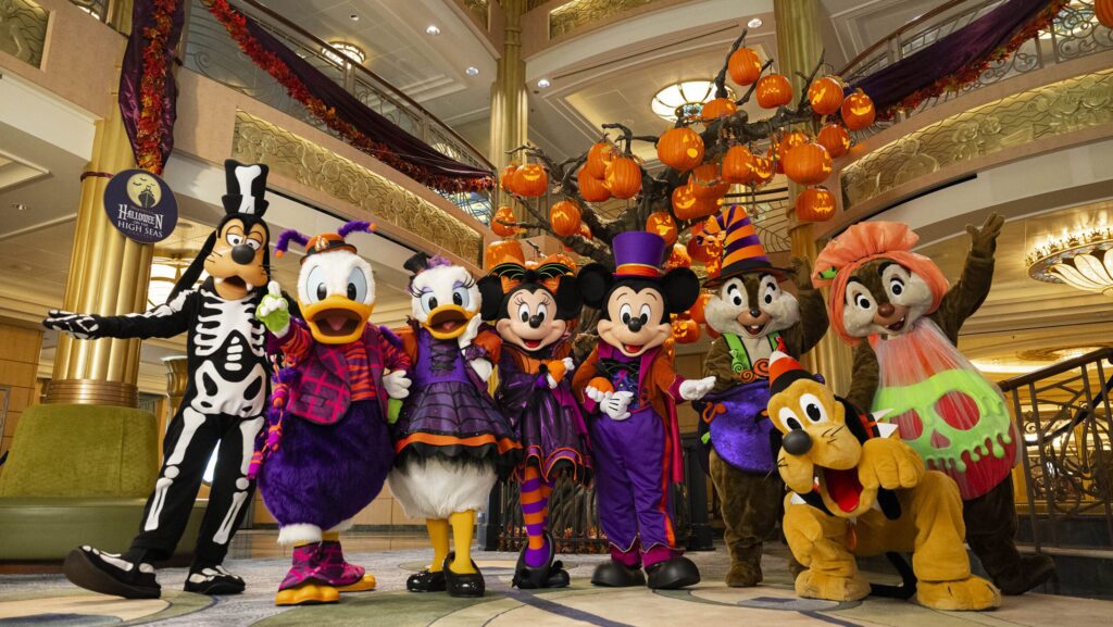Mickey and friends in Halloween costumes on a Disney cruise