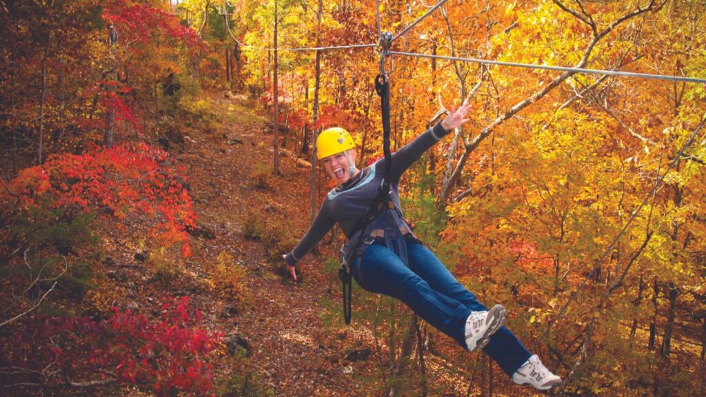 Fall foliage zip lining in Branson, Missouri (Photo: Branson Convention and Visitors Bureau)