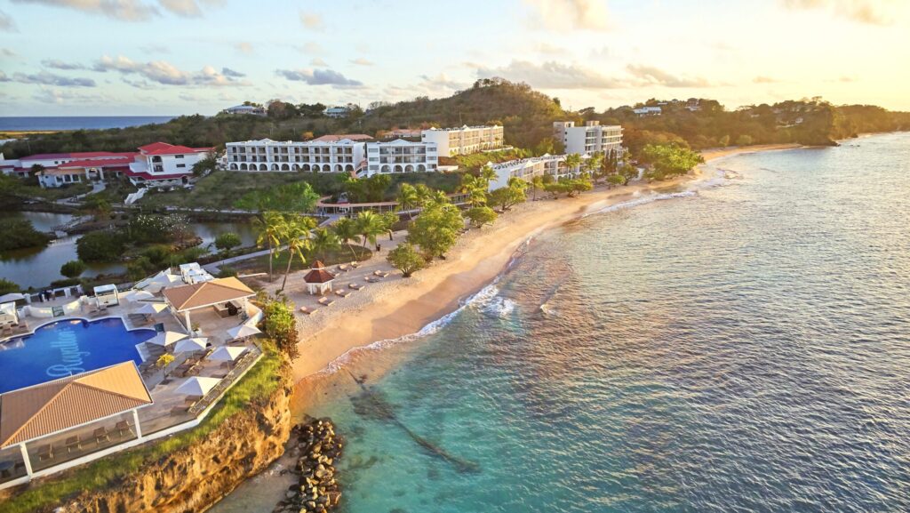 An aerial view of Royalton Grenada resort and the beach at sunset