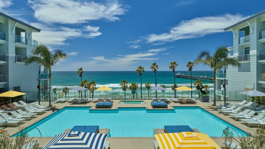 View of the pool and the ocean beyond at Oceanside's Seabird Resort