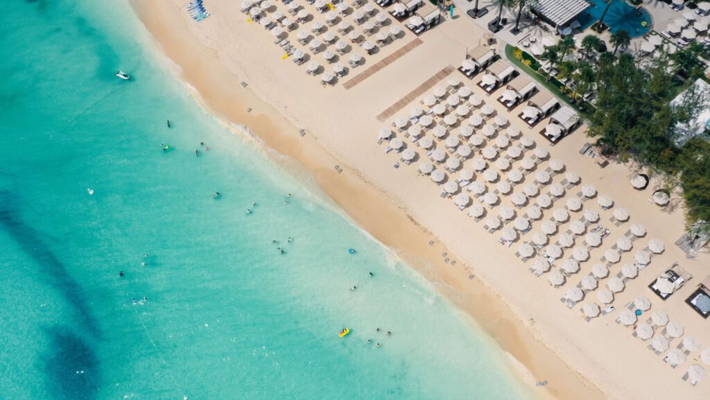 An aerial view of chairs and umbrellas on the beach at The Westin Grand Cayman Seven Mile Beach Resort & Spa