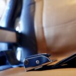 closeup of airplane seat and seatbelt