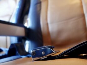 closeup of airplane seat and seatbelt