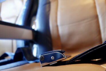 closeup of airplane seat and seatbelt