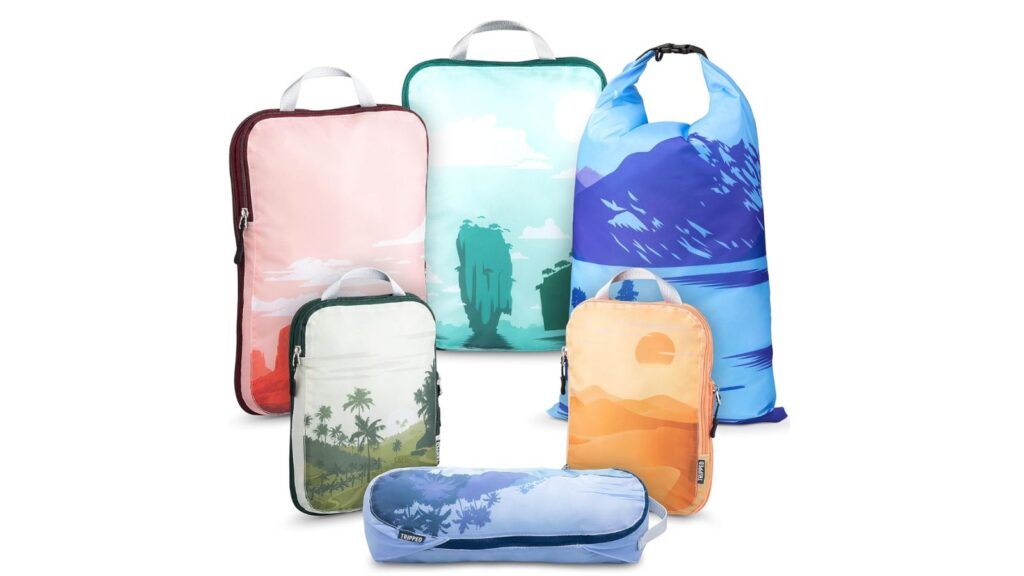 Set of Tripped Travel Gear packing cubes, with designs like sunset and palm trees