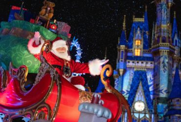 Santa in front of Cinderella Castle at Walt Disney World