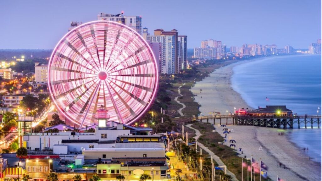 Myrtle Beach skyline at dusk with ferris wheel lit up and spinning (Photo: Envato:SeanPavone)