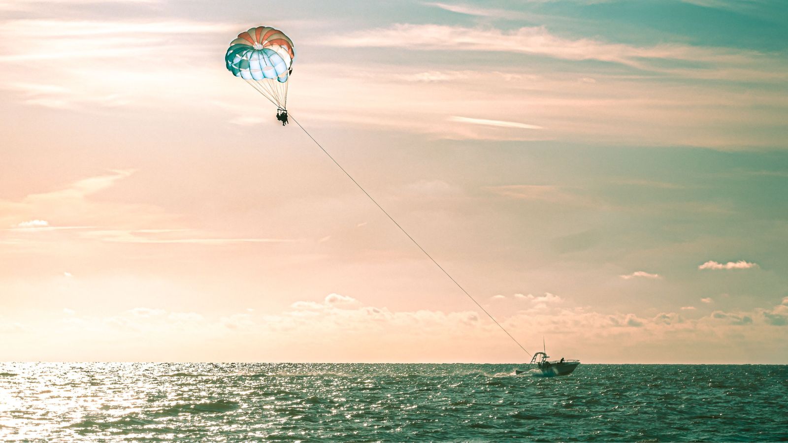 Parasailing at sunset above Clearwater Beach, Florida (Photo: Envato)