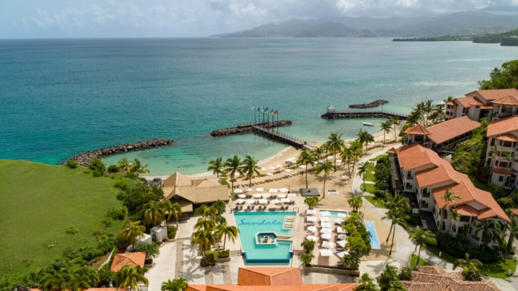 An aerial view of the pool and beach area at Sandals Grenada