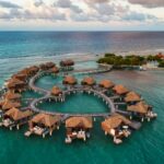 An aerial view of the overwater bungalows at Sandals Royal Caribbean