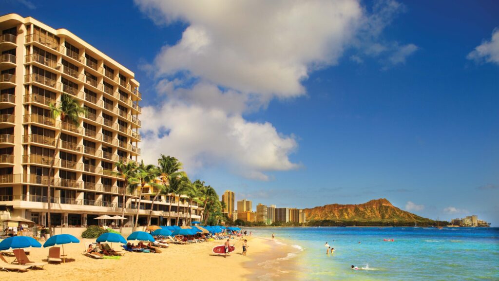 The beach and the exterior of OUTRIGGER Reef Waikiki Beach Resort