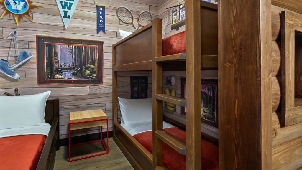 A themed suite that looks like a camping cabin with bunk beds at Great Wolf Lodge