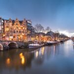 December holiday lights in Amsterdam, with lit up bridges and canals