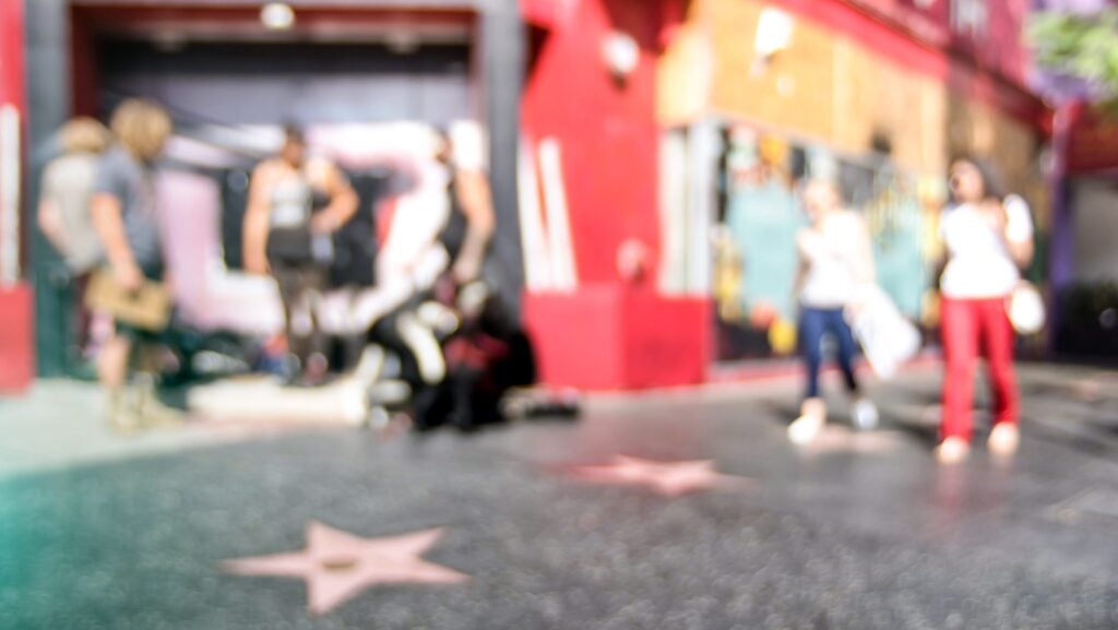 blurred view of stars on the sidewalk of Walk Of Fame on Hollywood Boulevard in LA 