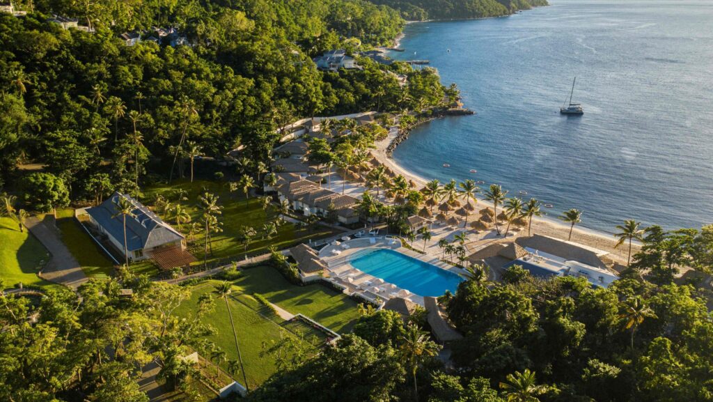 An aerial view of the resort, pool, and beach at Sugar Beach, A Viceroy Resort