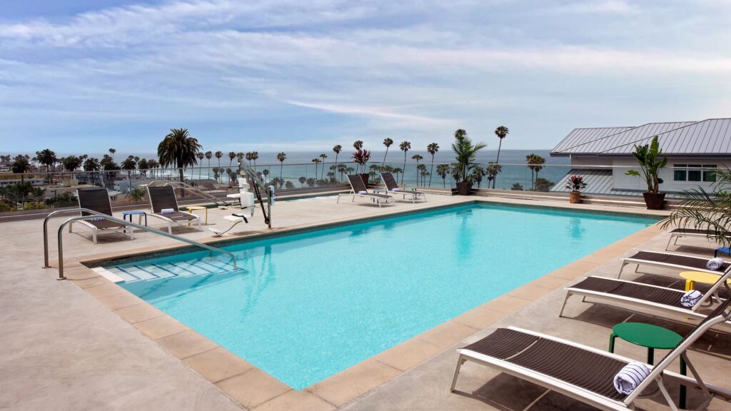 SpringHill Suites Oceanside/Downtown rooftop pool with view of ocean in distance