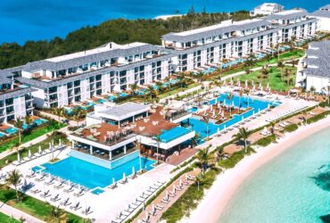 An aerial view of pools and the beach at Excellence Oyster Bay