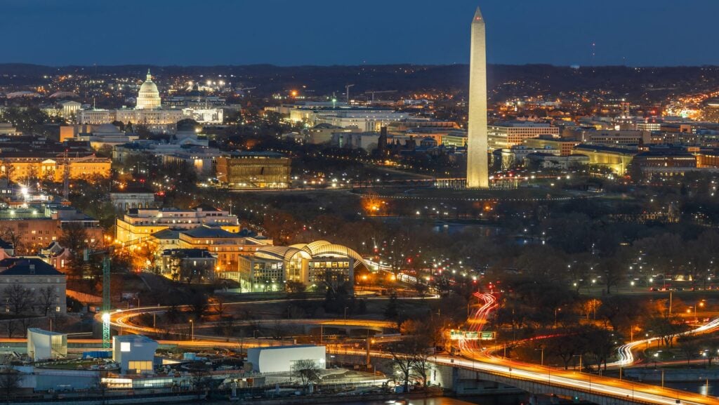 View over Washington DC in winter at night, with monuments lit up