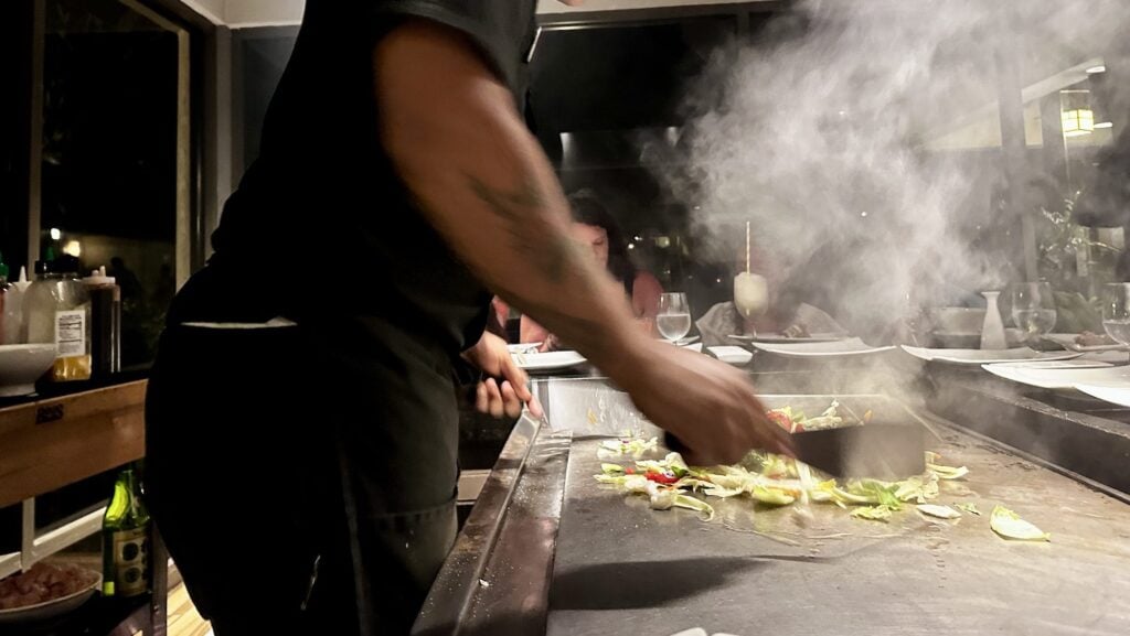 Chef cooking Teppanyaki style at Kimonos restaurant at Beaches Turks & Caicos