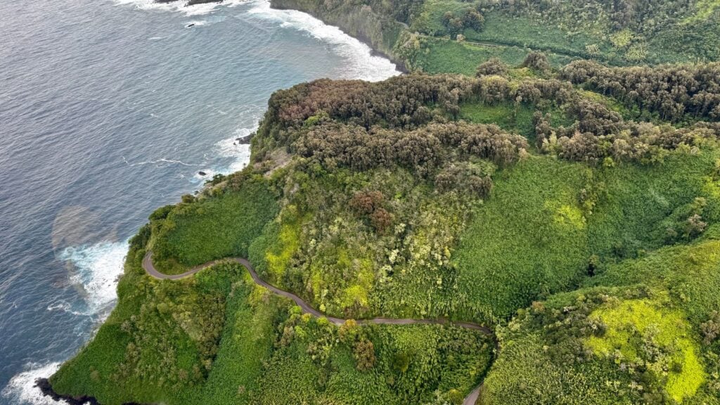 aerial view from a helicopter of the Road to Hana, with the Pacific coastline visible as well