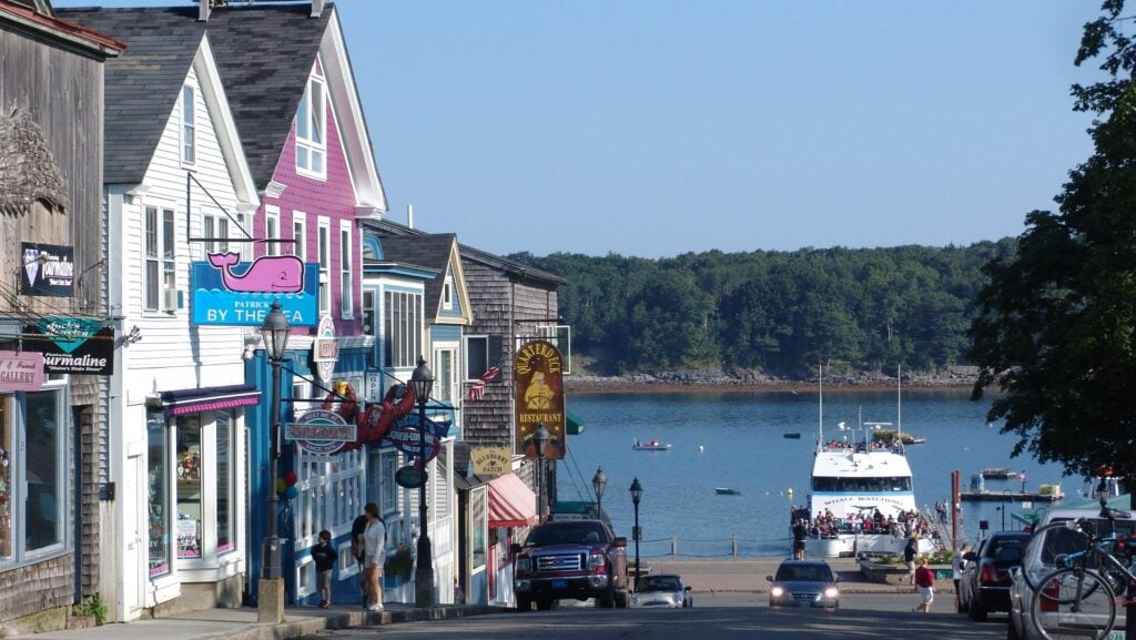 Bar Harbor main street with whale watching boat in the background