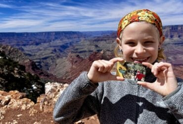 child holding fourth grade national parks pass
