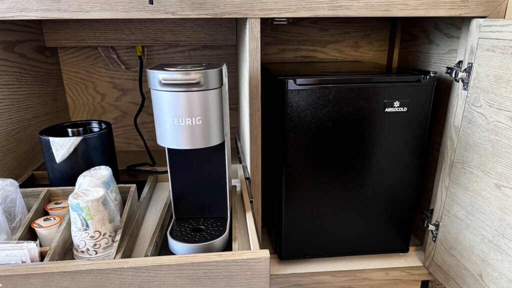 view of coffee maker and mini-fridge in rooms at Knott's Hotel at Knott's Berry Farm