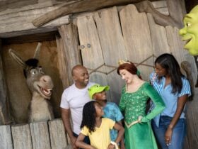 Family meeting Shrek characters inside DreamWorks Land at Universal Orlando Resort.